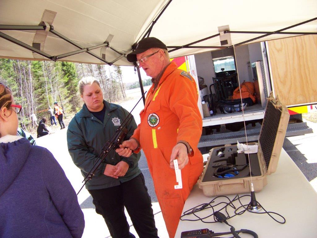 A team member demonstrates how the bracelets and accompanying gear works.
